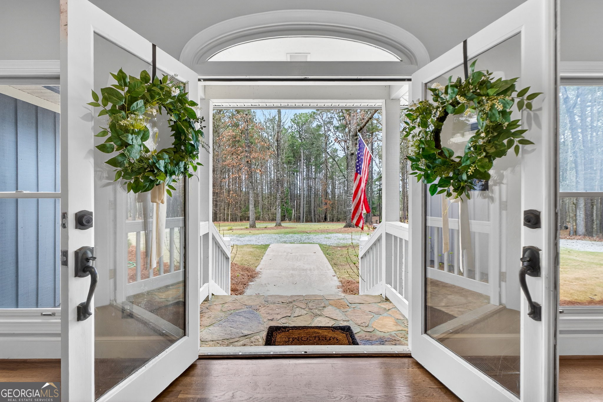 7581 Old Zebulon Road Molena, GA 30258 - Photo 8 of 79 a living room with a fireplace furniture and a large window