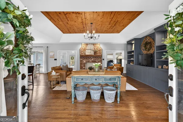 a living room with furniture and fireplace