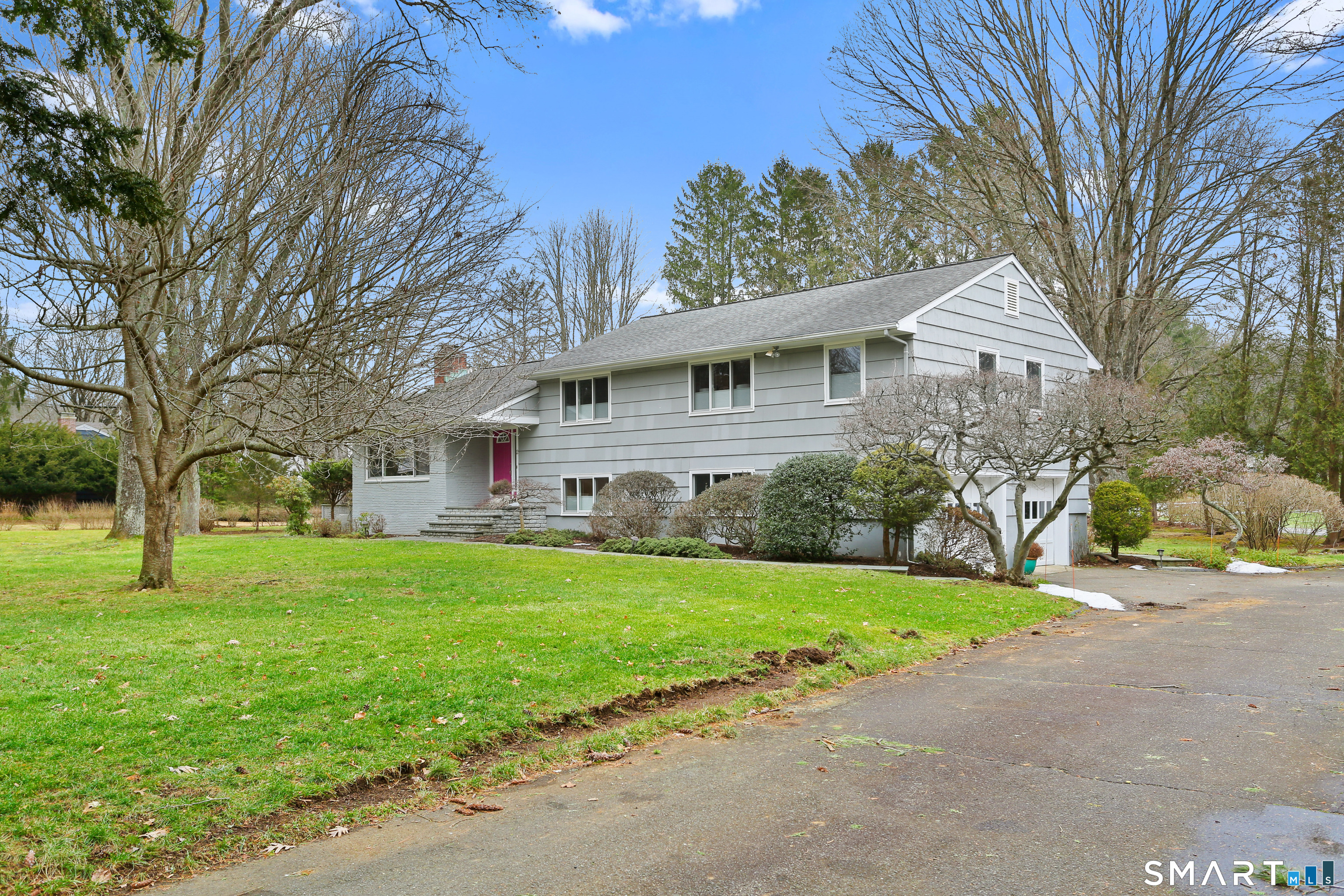 2 Rockyfield Road Westport, CT 06880 - Photo 15 of 40 Gracefully sited on the property, the front door features a stunning flowering tree