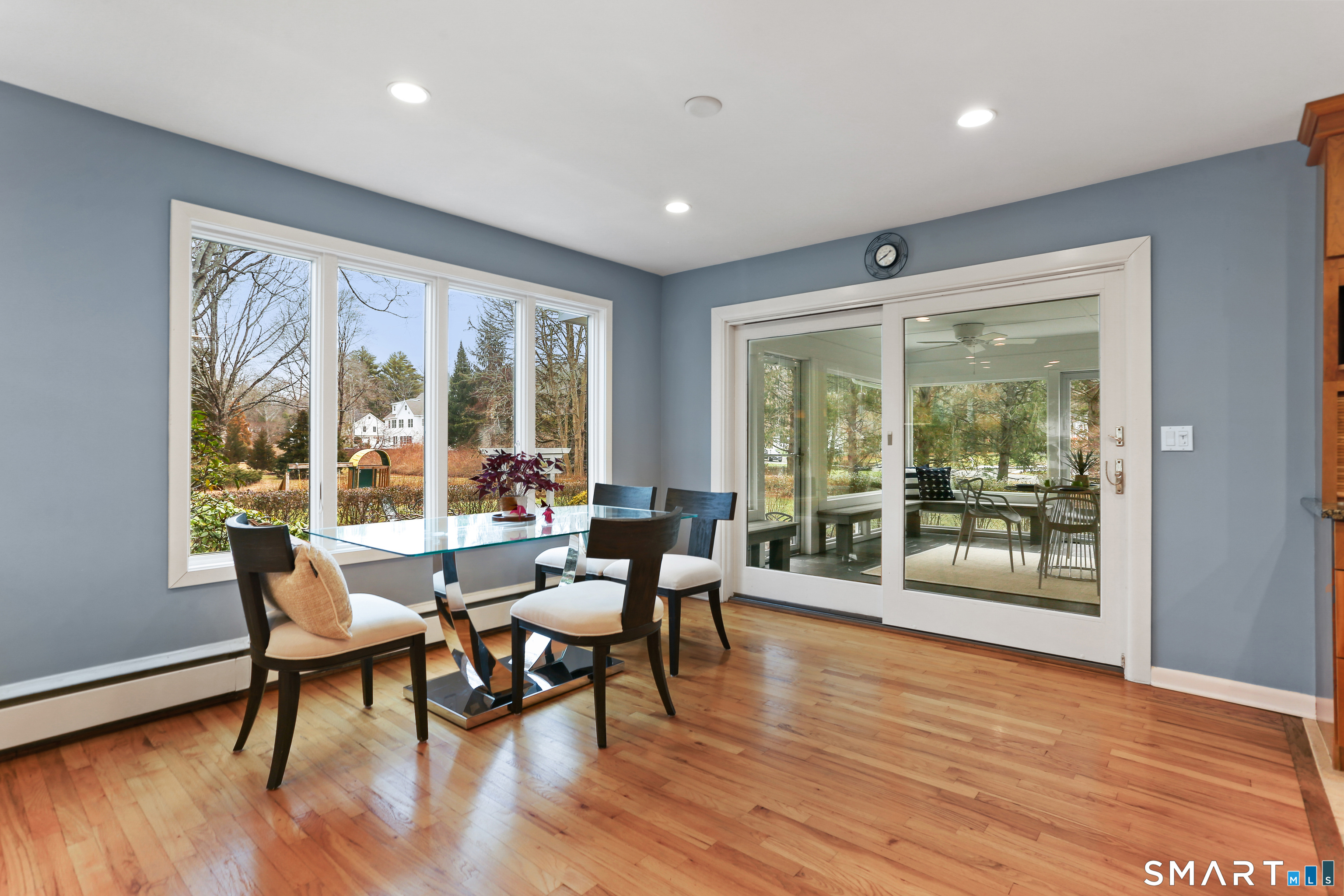 2 Rockyfield Road Westport, CT 06880 - Photo 25 of 40 Large windows overlook the gardens from the dining area; easily access the 3 season porch