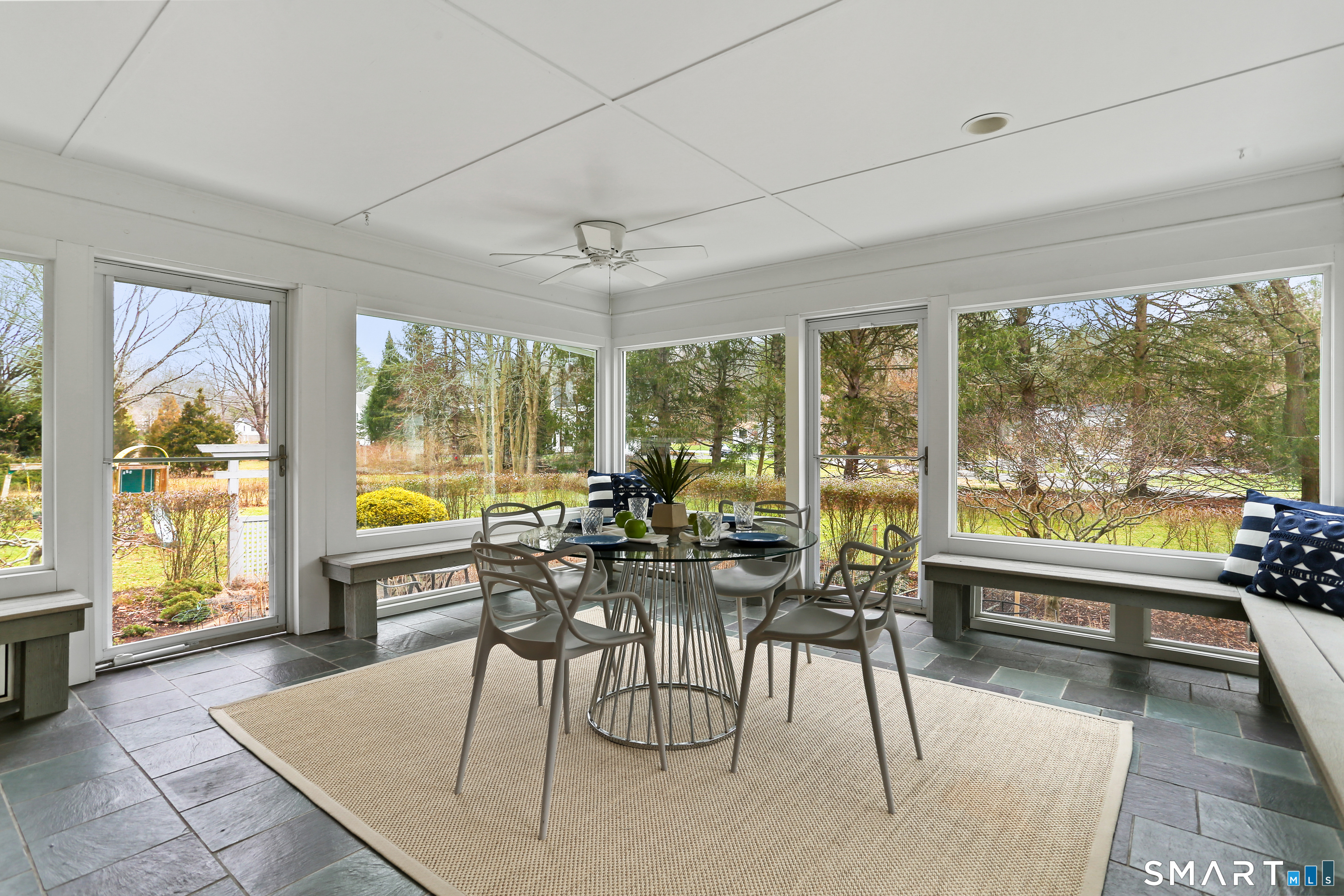 2 Rockyfield Road Westport, CT 06880 - Photo 27 of 40 Large 3-season porch offers views of the garden & yard, and easy access to the yard via 3 doors to the surrounding deck