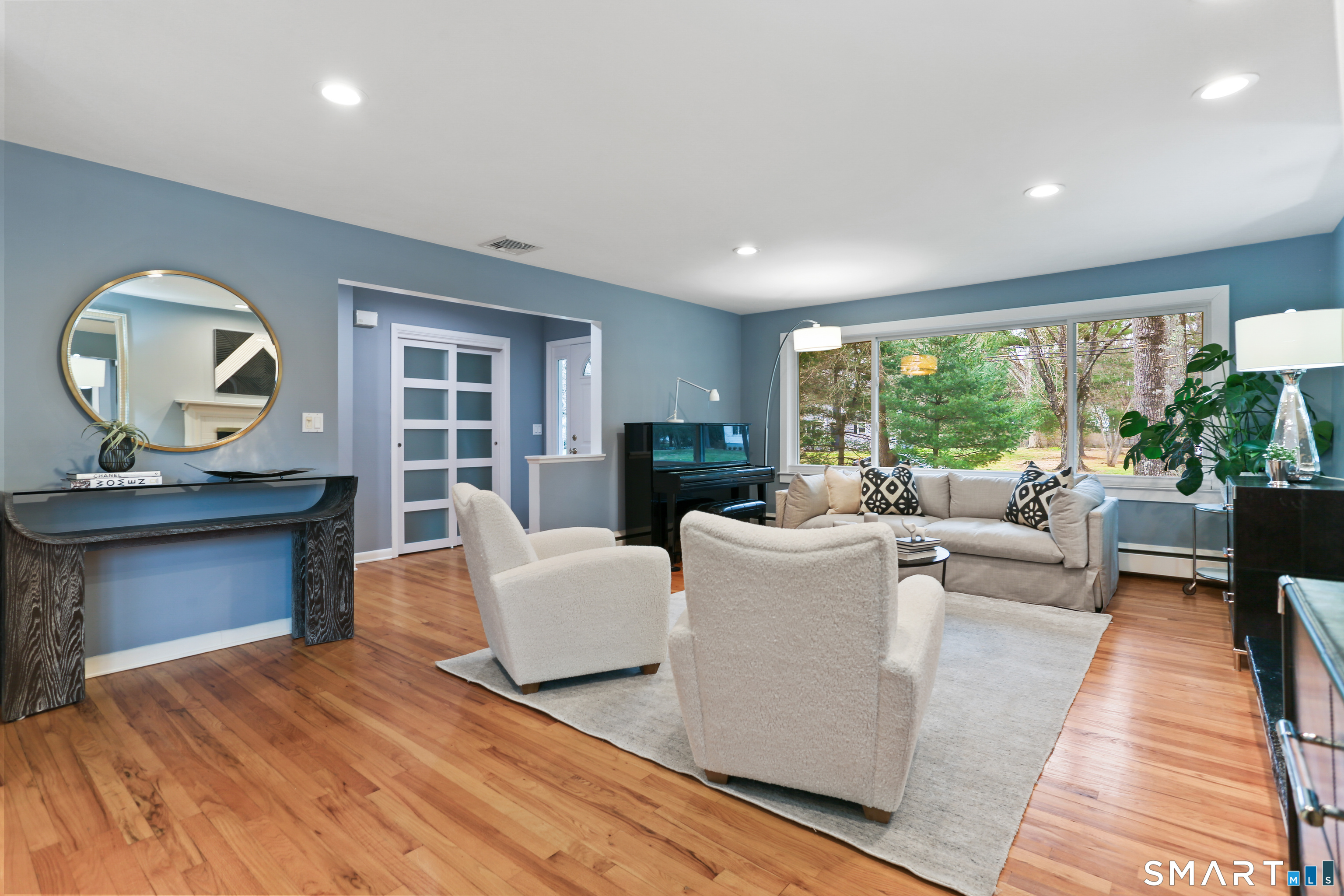 2 Rockyfield Road Westport, CT 06880 - Photo 3 of 40 The sunny living room makes gathering a pleasure