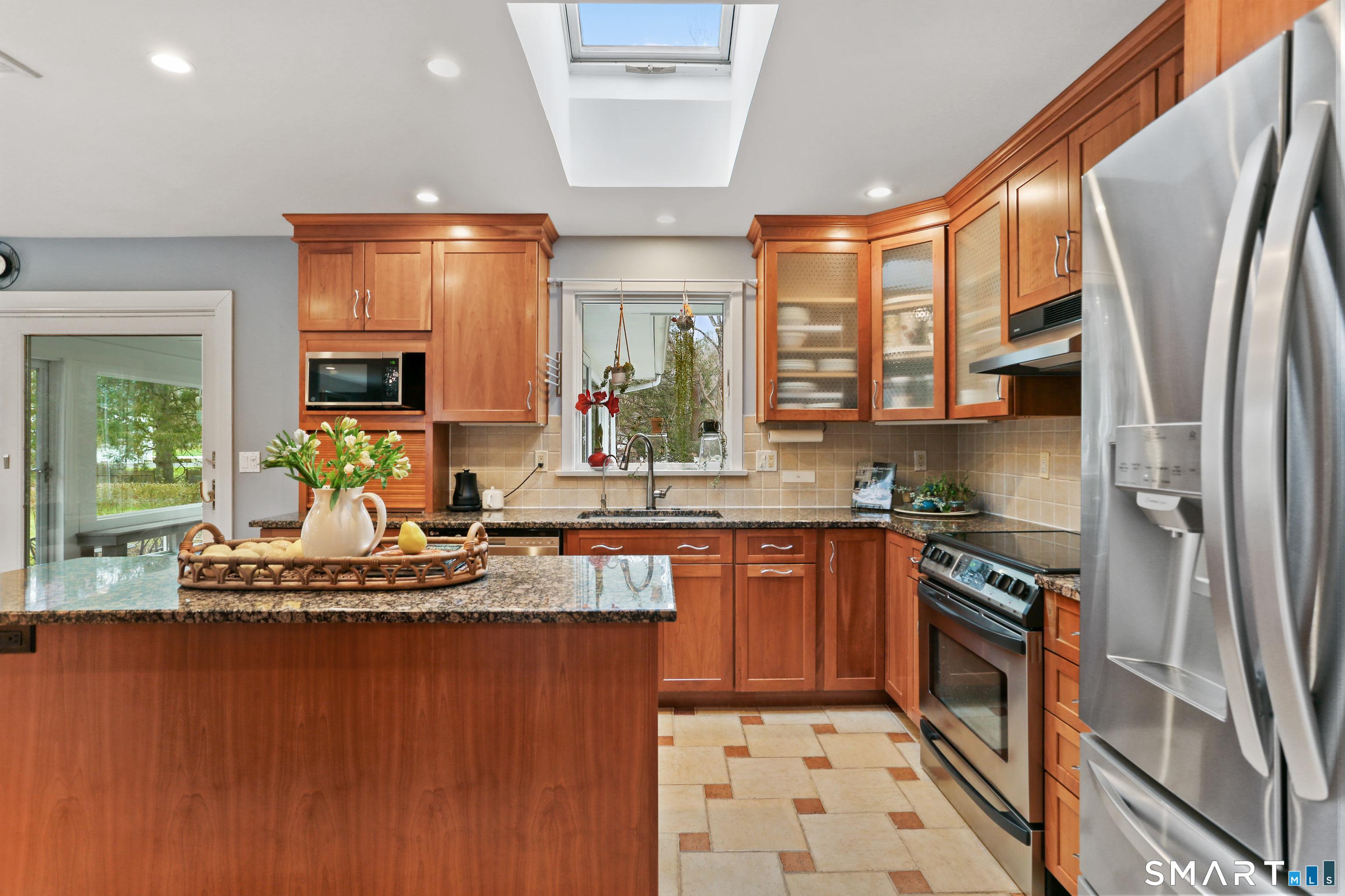 2 Rockyfield Road Westport, CT 06880 - Photo 35 of 40 Sleek wood cabinetry is noteworthy in this kitchen