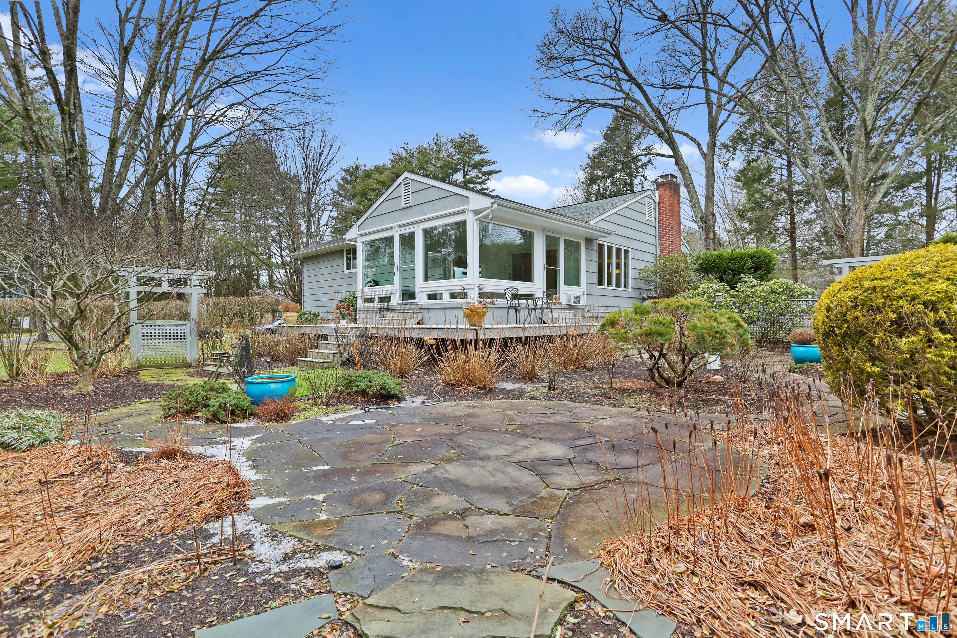 2 Rockyfield Road Westport, CT 06880 - Photo 37 of 40 Charming stone patio and pathways wander around beautifully landscaped garden filled with flowering shrubs