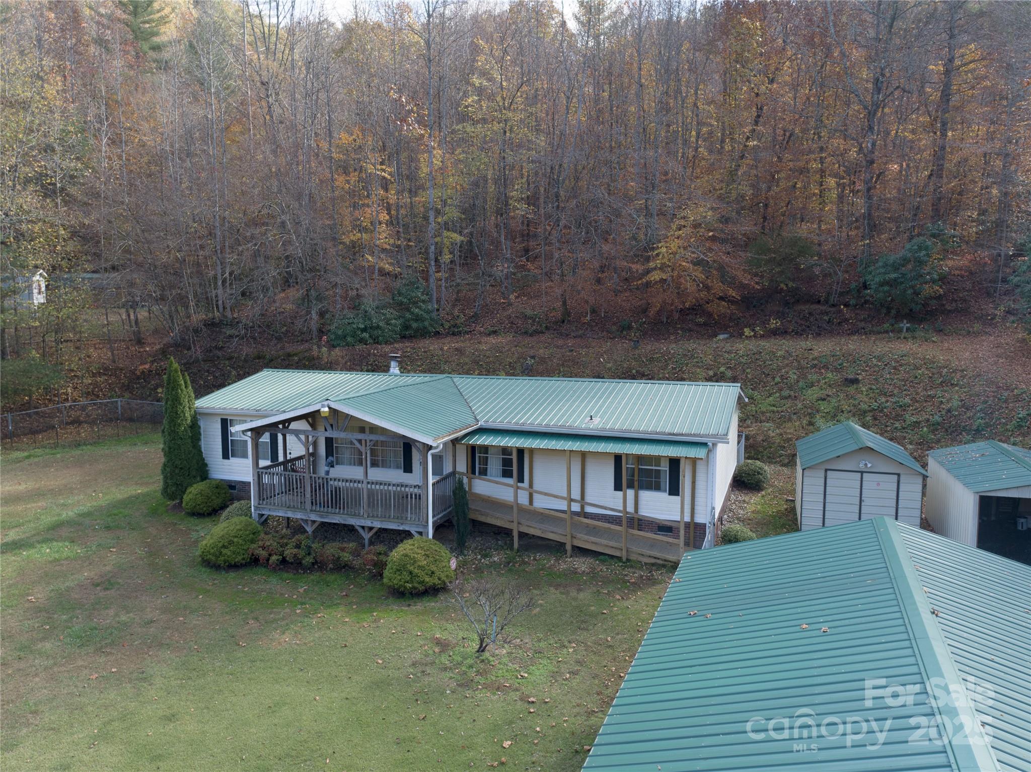1922 Zacks Fork Road Lenoir, NC 28645 - Photo 13 of 27 a aerial view of a house with a yard and balcony
