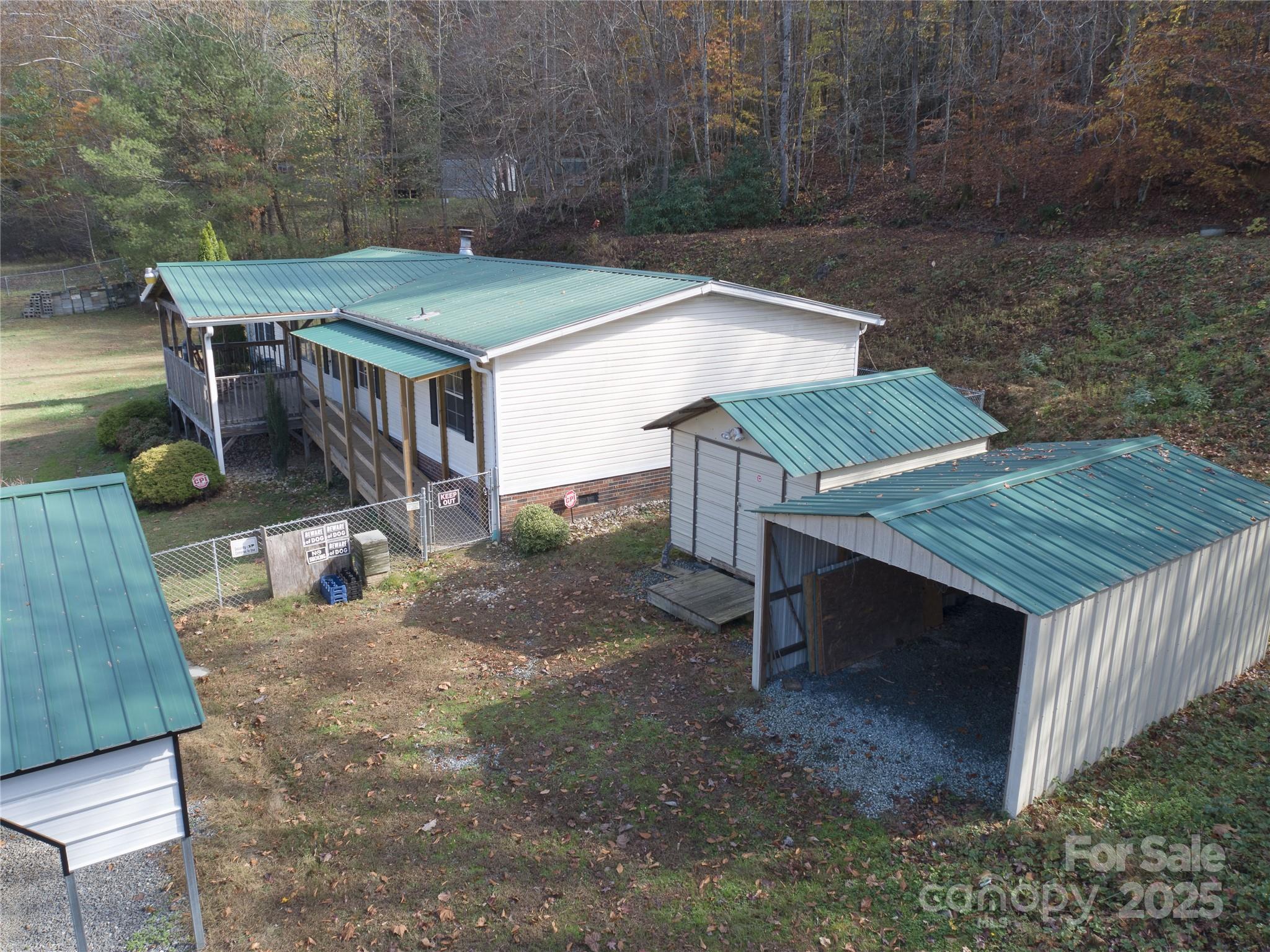 1922 Zacks Fork Road Lenoir, NC 28645 - Photo 21 of 27 a view of a roof deck with wooden fence
