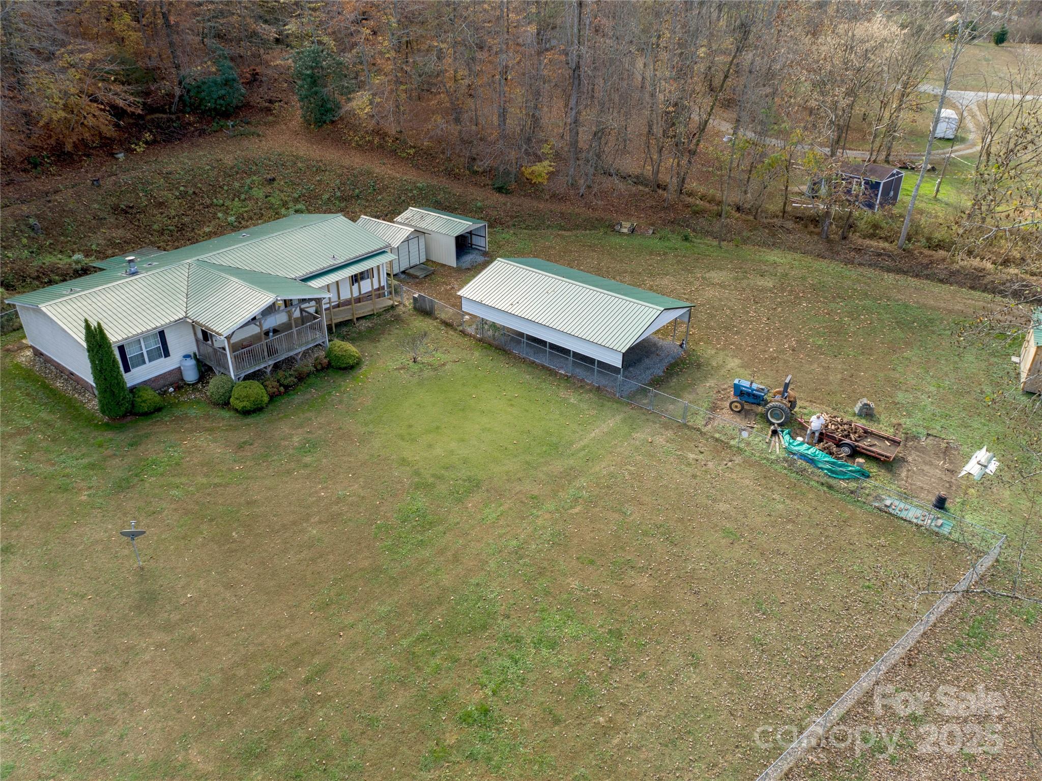 1922 Zacks Fork Road Lenoir, NC 28645 - Photo 4 of 27 an aerial view of a house with a garden and lake view