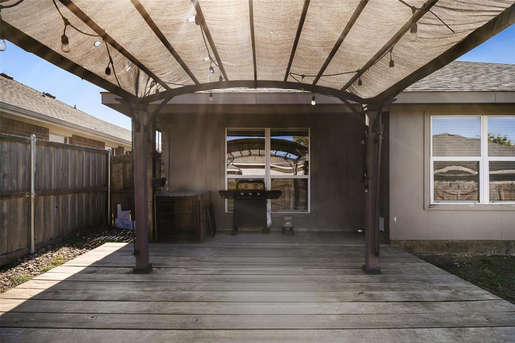 1424 Jacksons Run Greenville, TX 75402 - Photo 22 of 23 a view of a porch with wooden floor and stairs