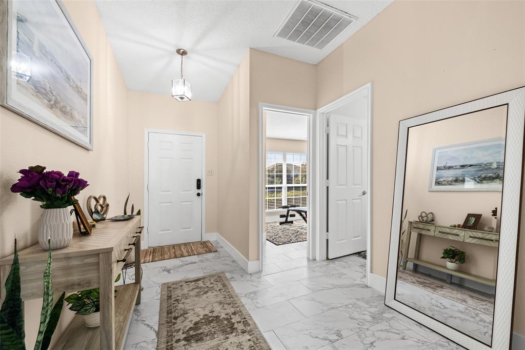 1424 Jacksons Run Greenville, TX 75402 - Photo 3 of 23 a living room with furniture and a floor to ceiling window