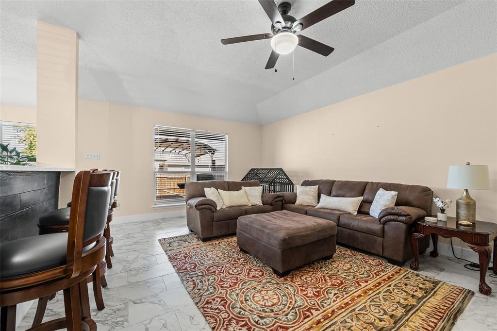 1424 Jacksons Run Greenville, TX 75402 - Photo 4 of 23 a living room with furniture and a rug