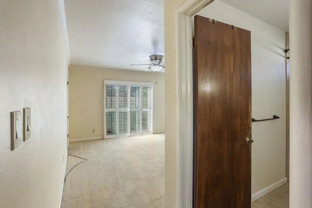 a view of an empty room with a window