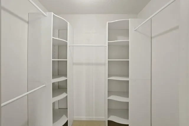 a view of an empty walk in closet