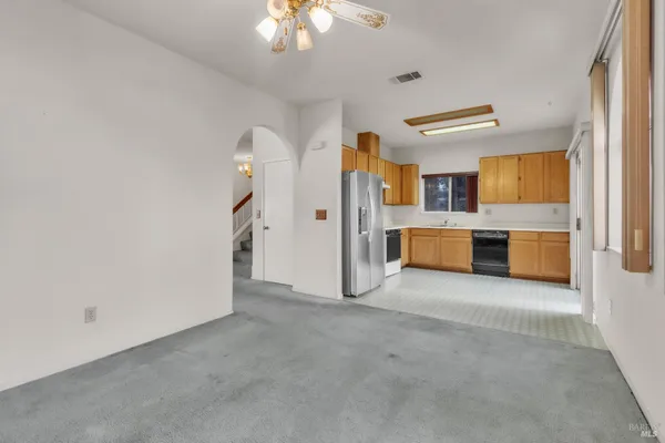 a view of a kitchen with a sink cabinet cabinet and a fireplace