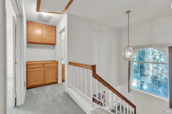 a view of a hallway with windows