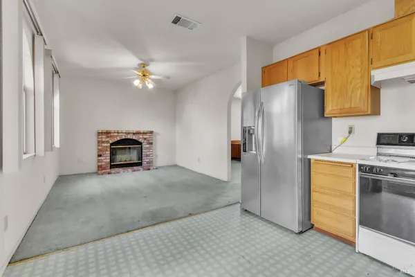 a kitchen with stainless steel appliances a stove and a refrigerator