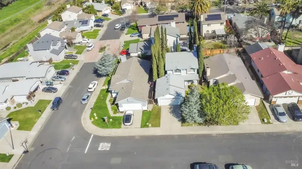 an aerial view of a house with a swimming pool