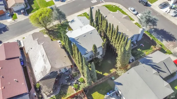 an aerial view of residential houses with outdoor space