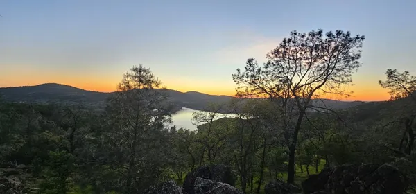 a view of a house with a mountain in the background
