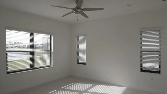 a view of an empty room and a window