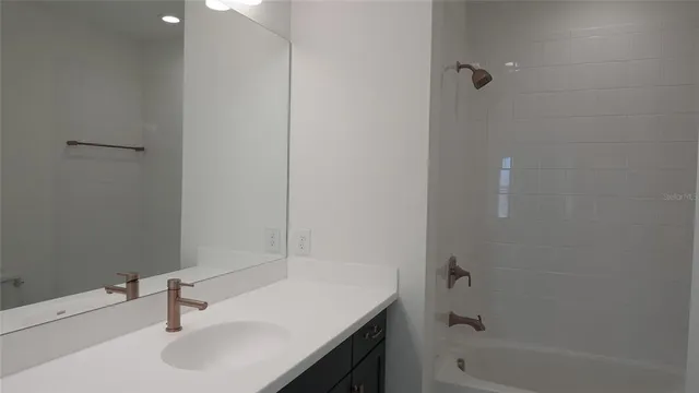 a bathroom with a sink and a bathtub