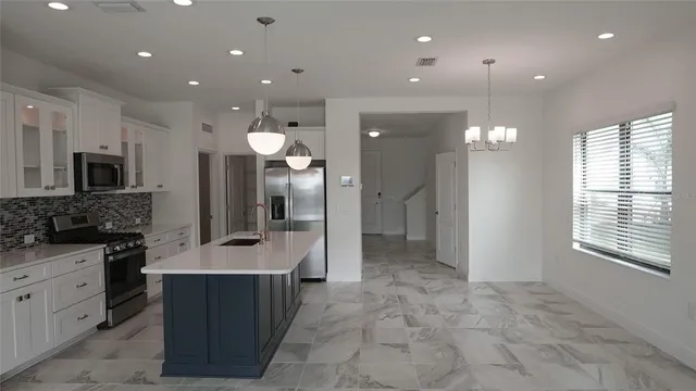a large bathroom with a large mirror vanity and a shower