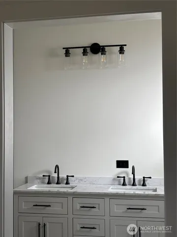 a hall with cabinets and wooden floor