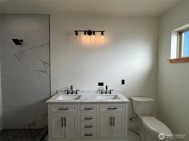 a view of a small space with wooden floor and a window