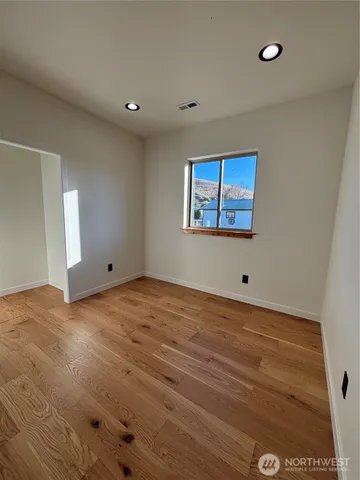 a bathroom with a sink a bathtub and a window