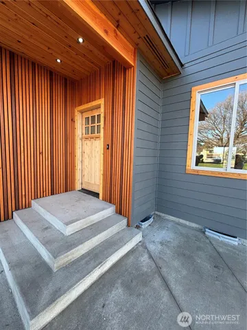 a view of an entryway with a door