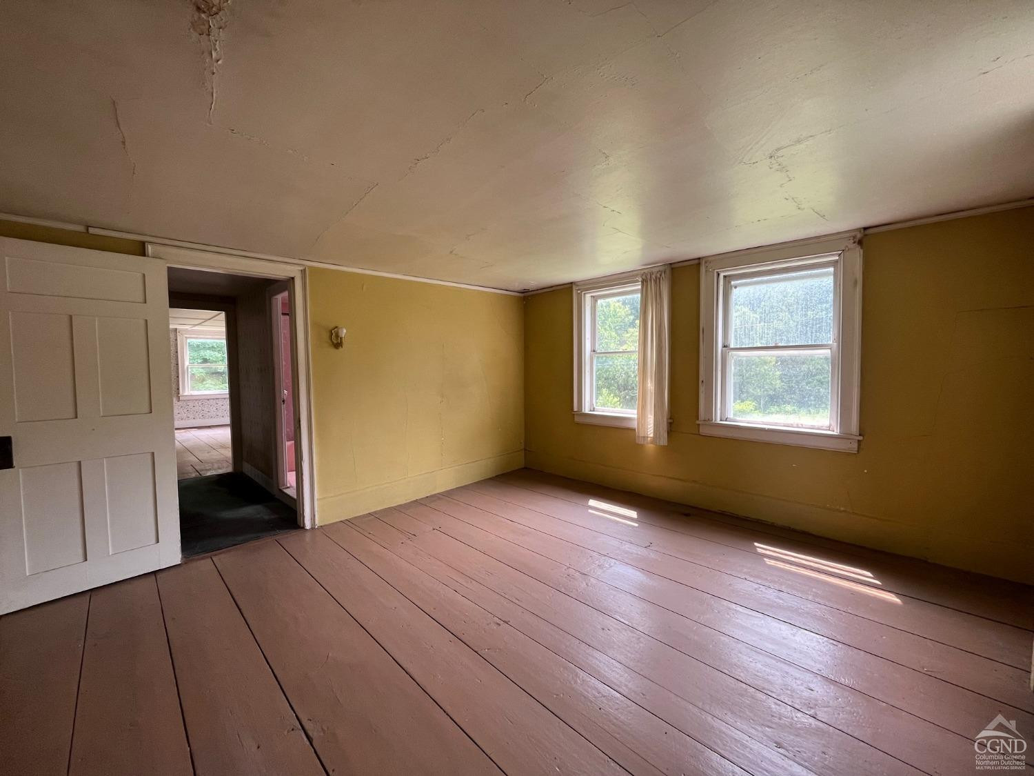 926 Smithfield Road Millerton, NY 12546 - Photo 25 of 27 wooden floor in an empty room with a window