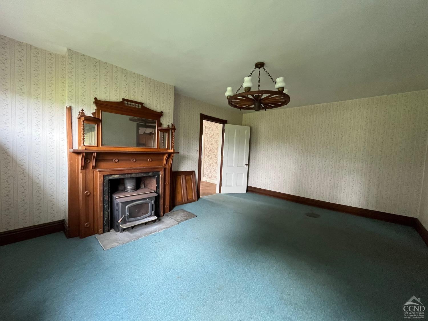 926 Smithfield Road Millerton, NY 12546 - Photo 7 of 27 a living room with furniture and a fireplace