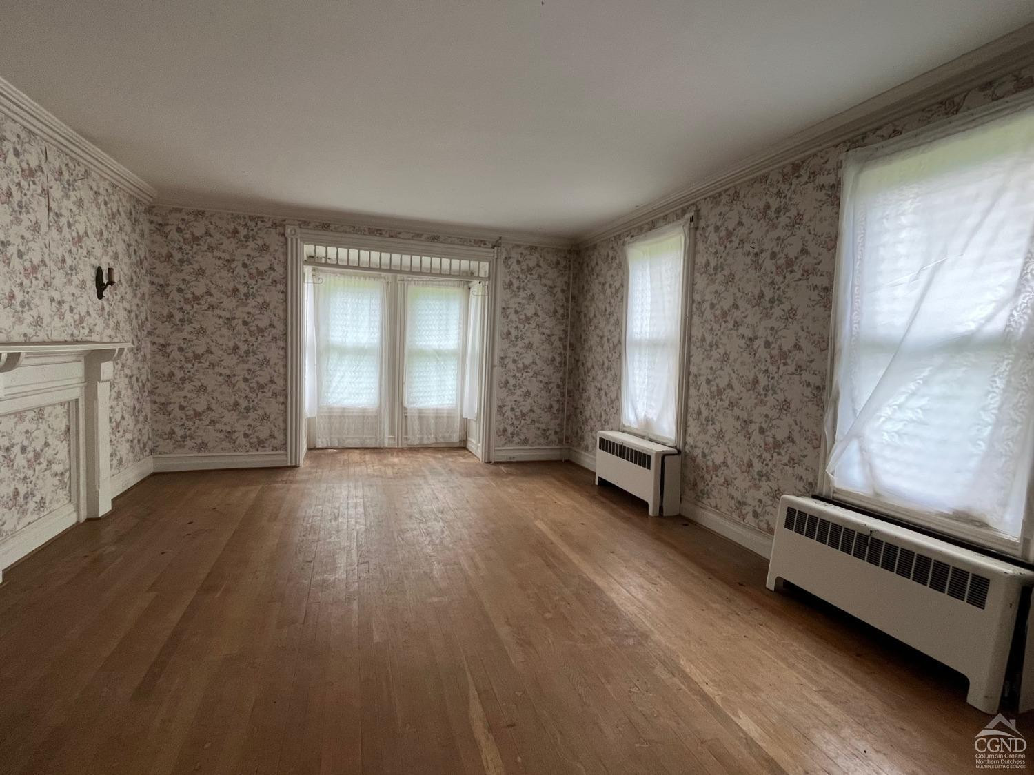 926 Smithfield Road Millerton, NY 12546 - Photo 9 of 27 a view of an empty room with a window and wooden floor