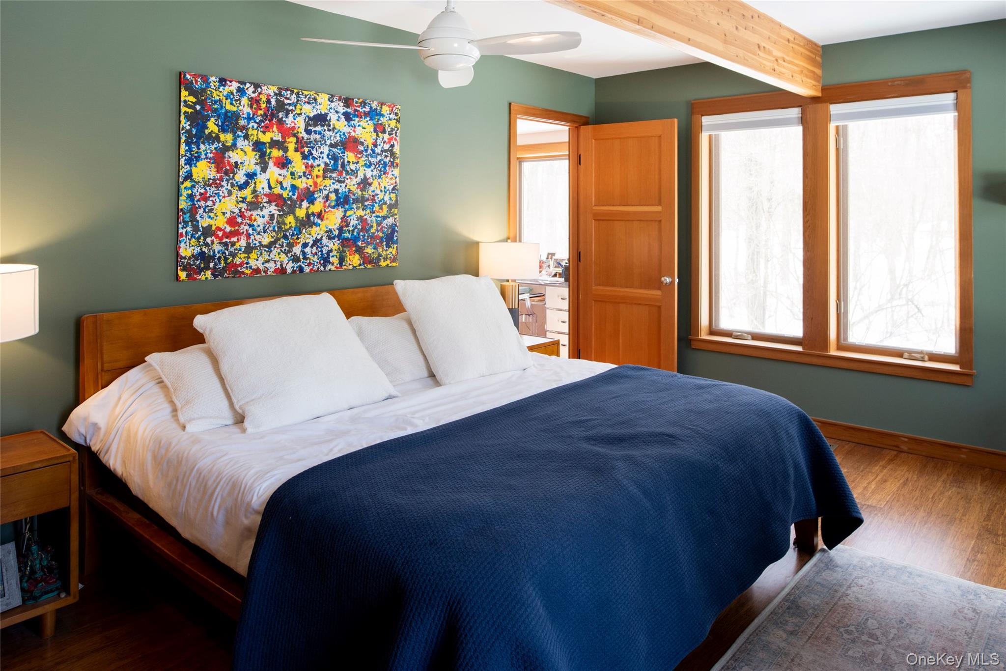 195 Vlei Road Rhinebeck, NY 12572 - Photo 11 of 25 a bedroom with a bed and a painting on the wall