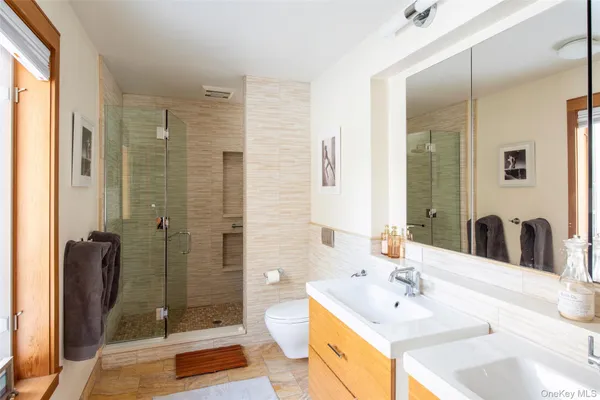 a bedroom with a bed and cupboard