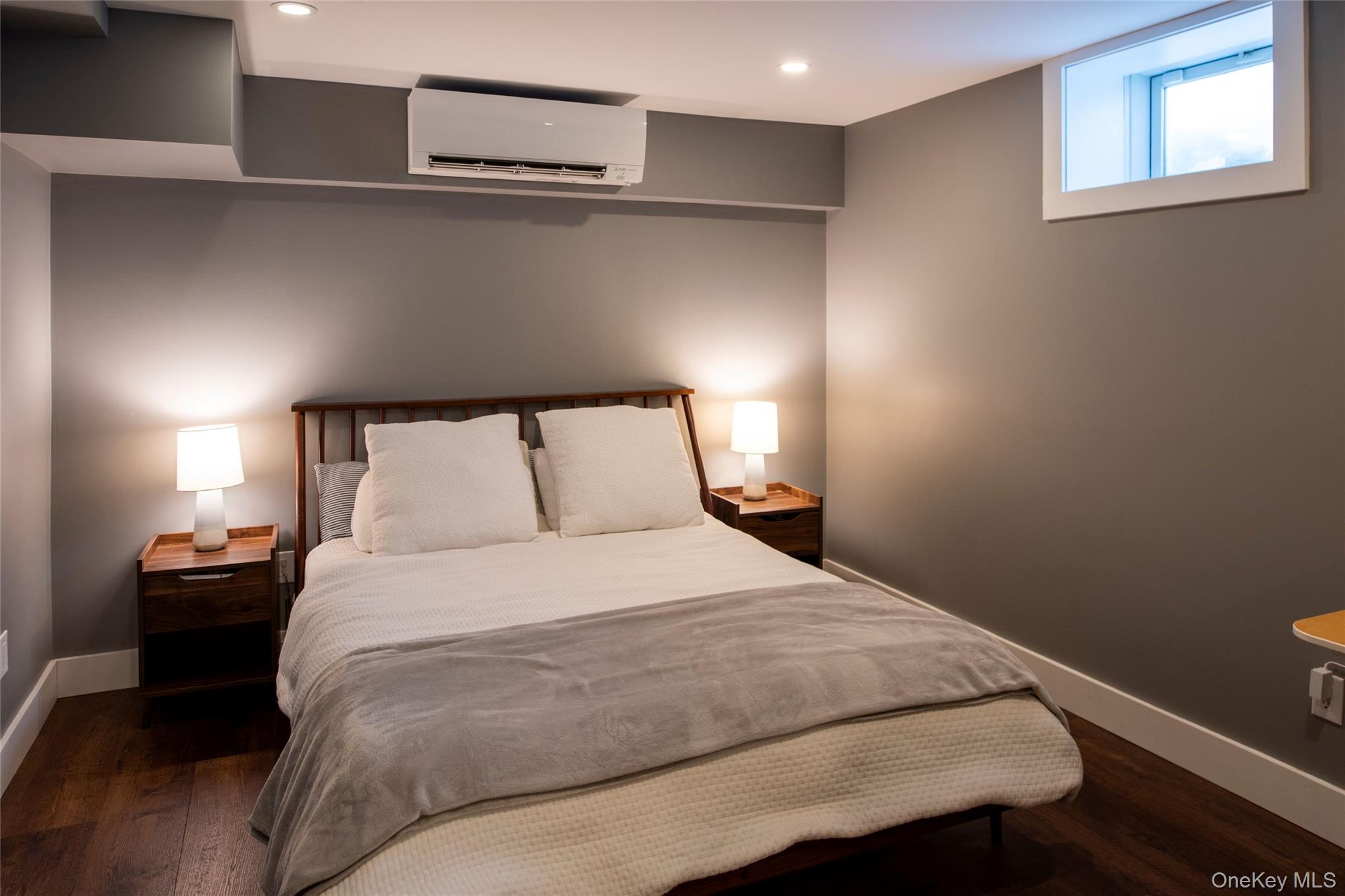 195 Vlei Road Rhinebeck, NY 12572 - Photo 22 of 25 a bedroom with a bed and lamps