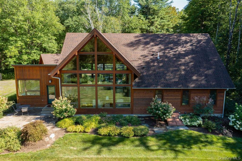 195 Vlei Road Rhinebeck, NY 12572 - Photo 24 of 25 a front view of a house with garden