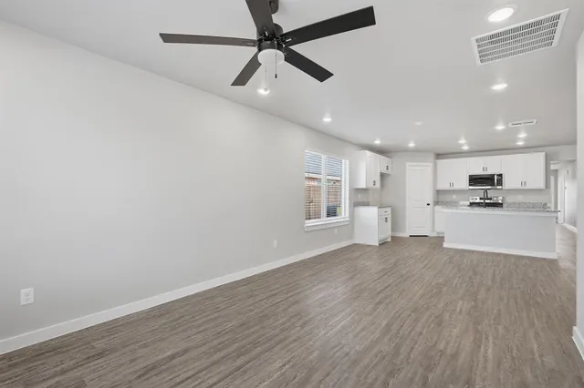 a view of kitchen with wooden floor and window