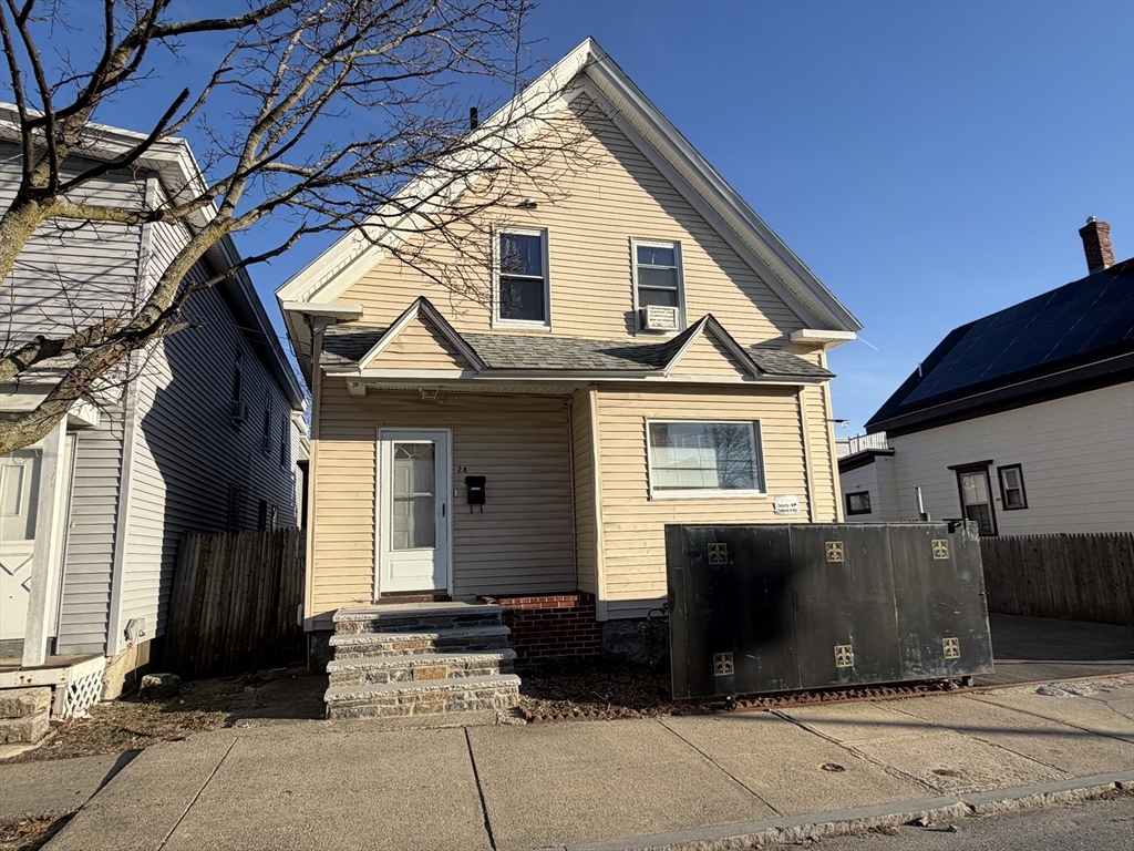 28-32 Chester Street Lawrence, MA 01843 - Photo 13 of 30 a view of a house with a door and wooden walls
