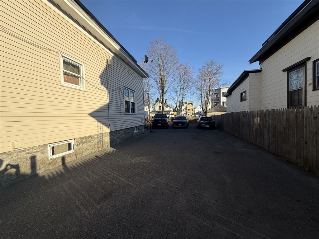 28-32 Chester Street Lawrence, MA 01843 - Photo 14 of 30 a view of a house with a yard