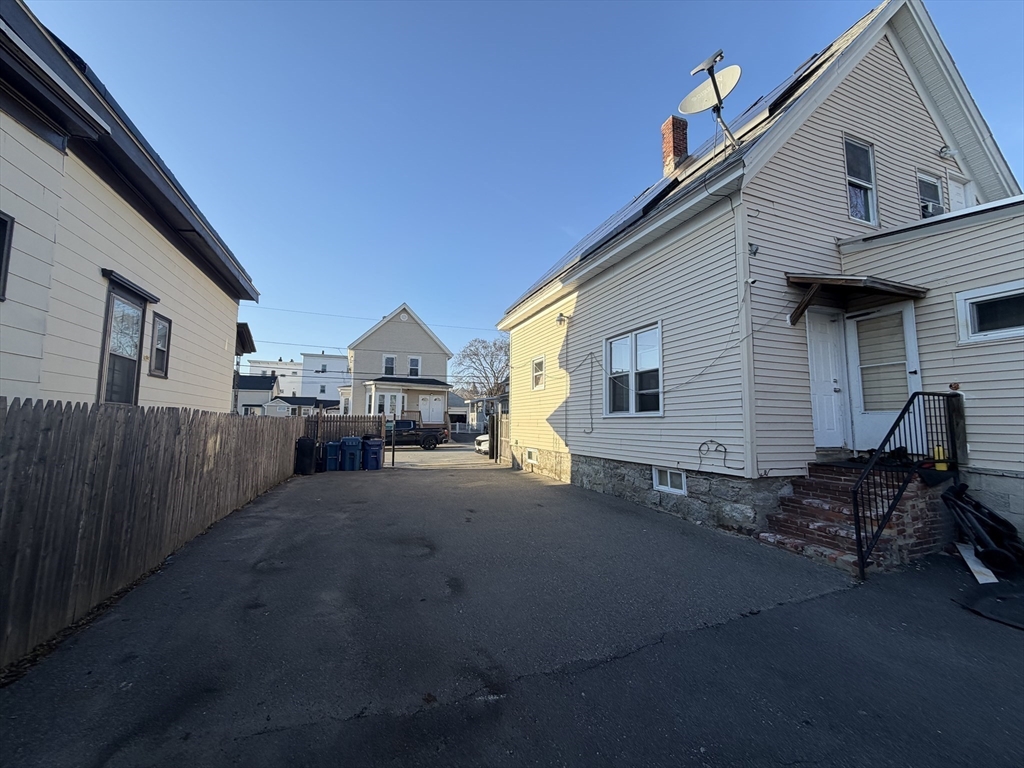 28-32 Chester Street Lawrence, MA 01843 - Photo 15 of 30 a view of a house with backyard and sitting area