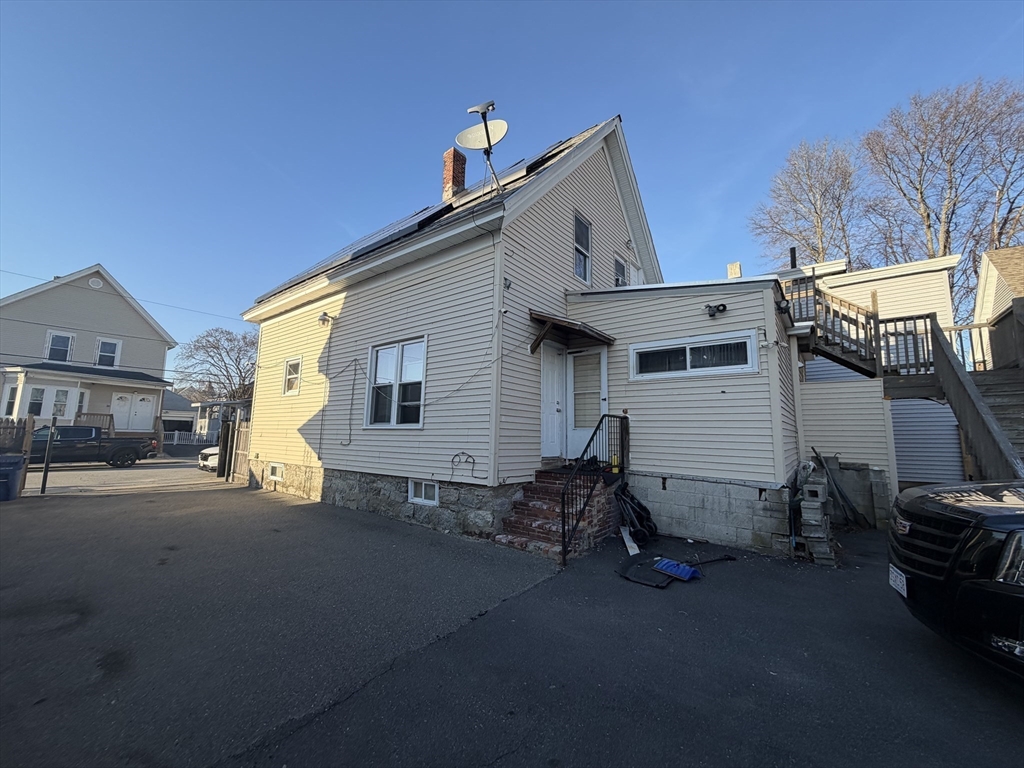 28-32 Chester Street Lawrence, MA 01843 - Photo 16 of 30 a view of a house with a yard
