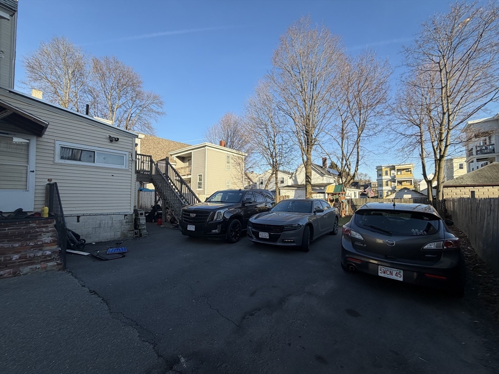 28-32 Chester Street Lawrence, MA 01843 - Photo 17 of 30 a view of a cars parked in front of a house