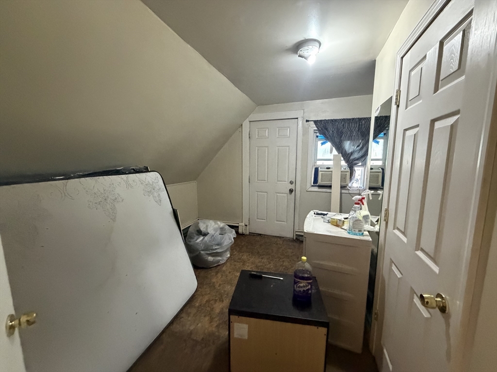 28-32 Chester Street Lawrence, MA 01843 - Photo 25 of 30 a bed room with furniture and a wooden floor