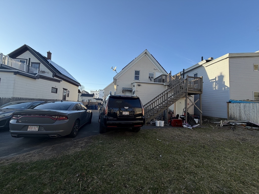 28-32 Chester Street Lawrence, MA 01843 - Photo 27 of 30 a couple of cars parked in front of a house