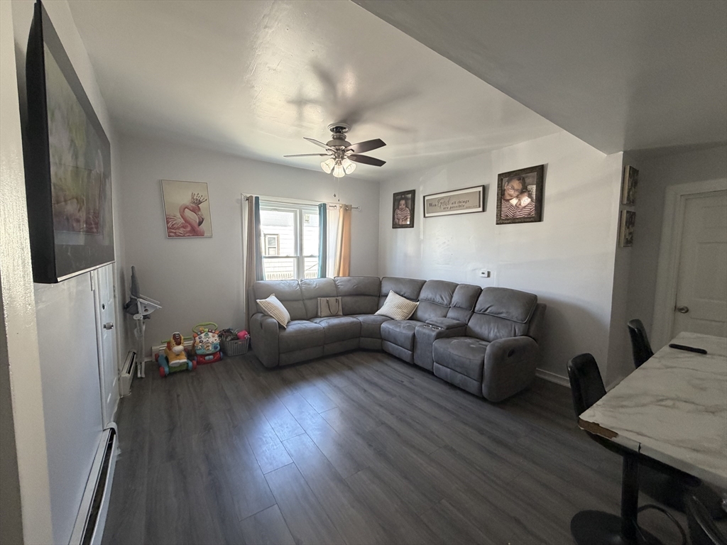 28-32 Chester Street Lawrence, MA 01843 - Photo 6 of 30 a living room with furniture and a flat screen tv