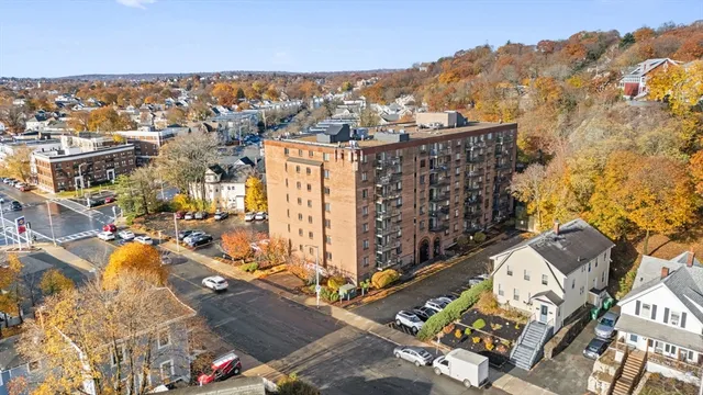 an aerial view of residential houses with city view