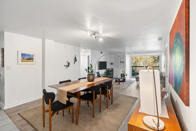 a view of a dining room with furniture and window