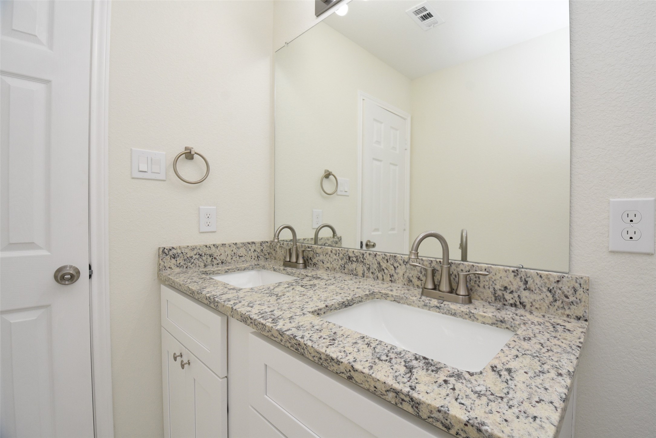 2803 Bowlin Leaf Lane Houston, TX 77014 - Photo 25 of 28 a bathroom with a granite countertop sink and a mirror