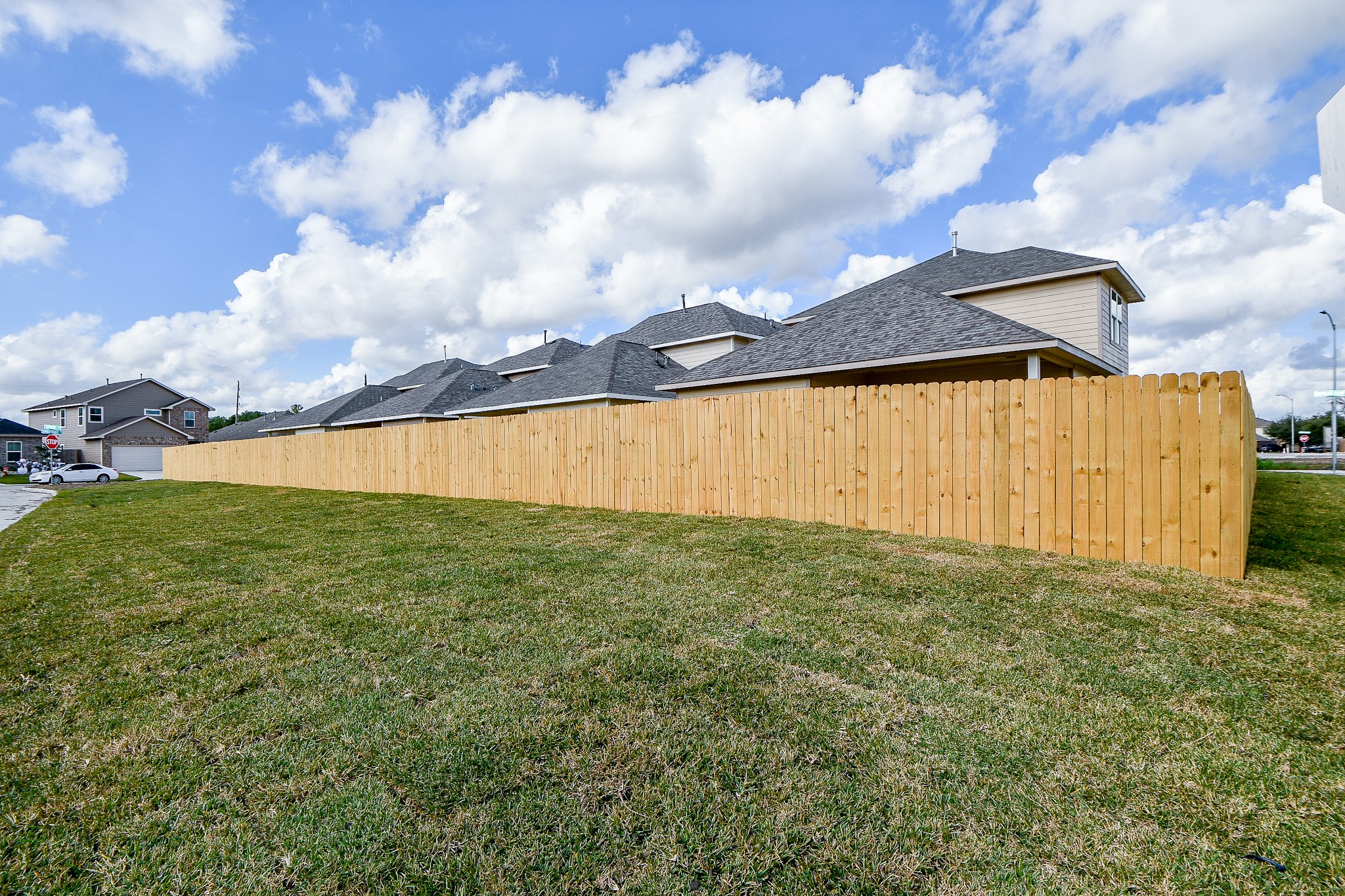 2803 Bowlin Leaf Lane Houston, TX 77014 - Photo 28 of 28 a view of a big yard with an empty space and wooden fence