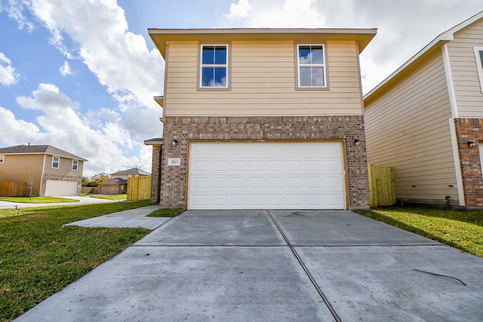 2803 Bowlin Leaf Lane Houston, TX 77014 - Photo 4 of 28 a front view of a house with a yard and garage